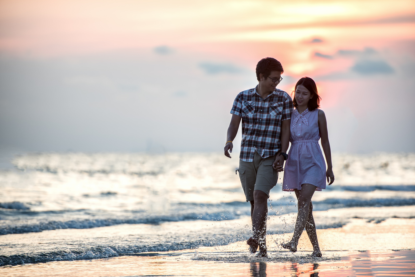 Young Couple Walking in the Beach